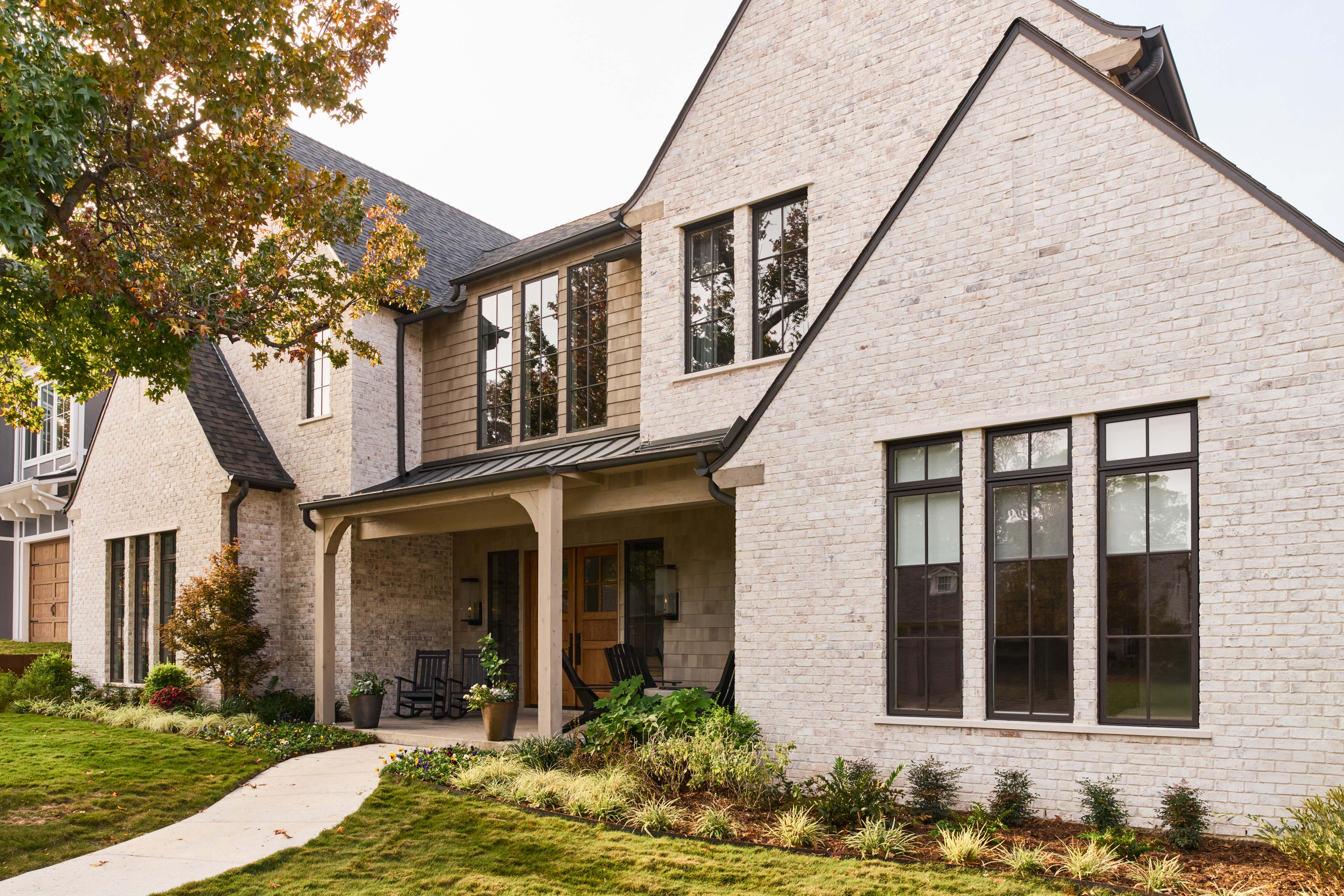Meadowglen exterior with limewashed brick and black-framed windows